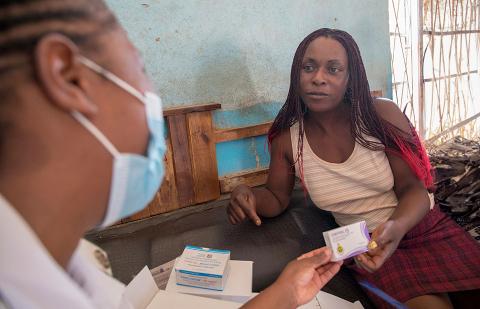 November 18, 2020: Skyline Kudzuramoto receives birth control pills from a mobile clinic set up at Musiyiwa Nite Club at Nzvimbo, Zimbabwe.